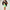Woman wearing a black sports bra and green shorts with a black jacket over shoulders on a plain background